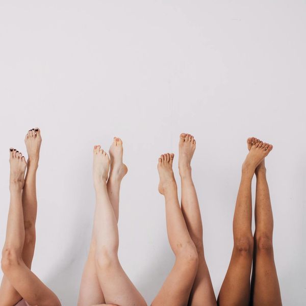 Diverse group of people smiling during a calm yoga session.